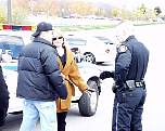 016Busted05_CopExplainsToGreg.jpg